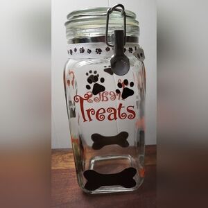 Dog Treat Jar with Black Paw Prints, White Ribbon, Letters "Treats" In Orange